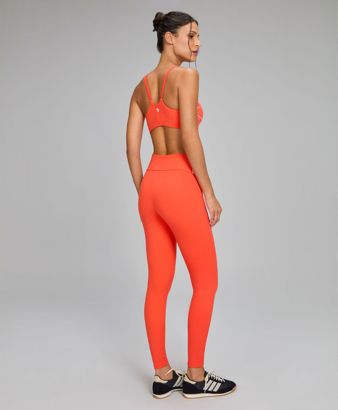 Legging Assimétrica Listras e Bolsos