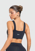 Conjunto Top e Calça Fitness Feminino Decote Reto Com Recortes Preto Básico Dlk