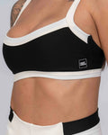 Conjunto Top e Calça Fitness Flow Duo Super Black com Off White